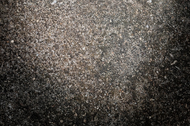 Foto grauer strukturierter zementwandhintergrund mit feinen betonspänen bauhintergründe