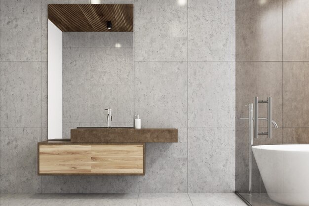 Graues Badezimmer mit Fliesenboden, weißer Badewanne und Waschbecken mit großem Spiegel. 3D-Rendering-Attrappe