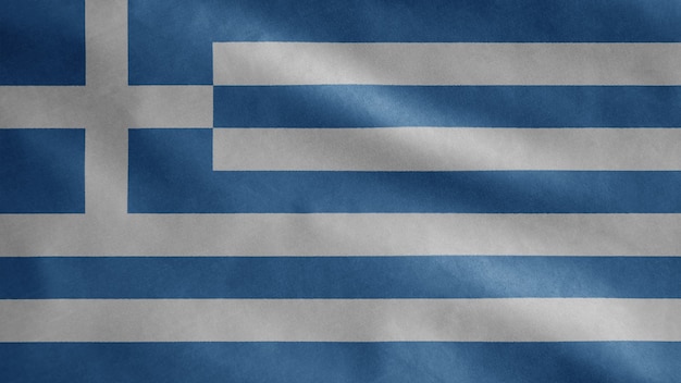 Foto griechische flagge, die im wind weht. nahaufnahme von griechenland banner weht, weiche und glatte seide