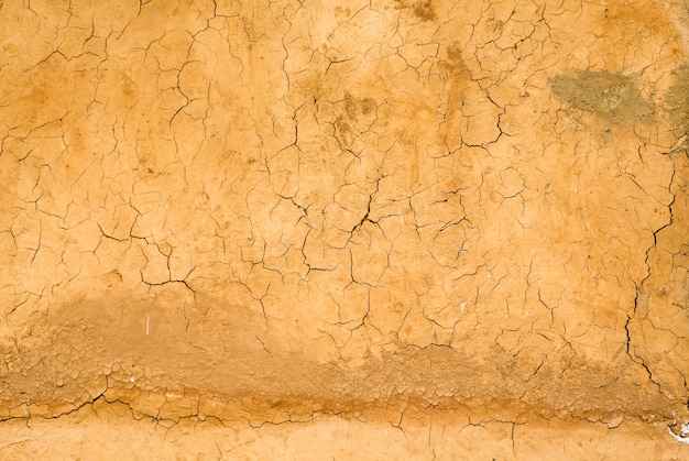 Foto grieta de la casa del suelo de la pared de la superficie naranja