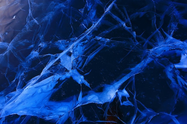 grietas de textura de hielo baikal, fondo abstracto hielo de invierno azul transparente