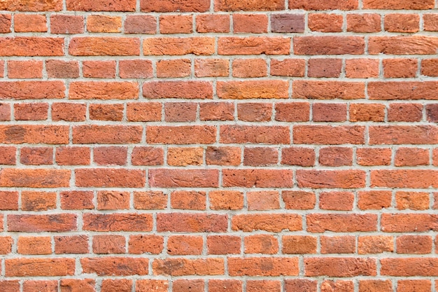 Großer Hintergrund einer alten roten Backsteinmauer