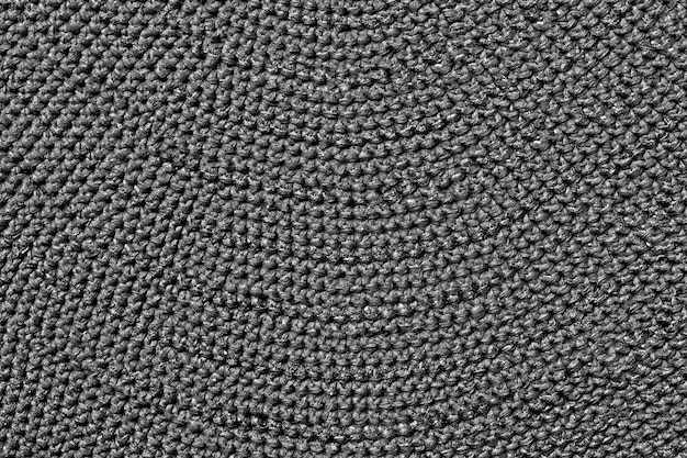 Großes Wollstricken in grauer Farbe Feste Oberfläche