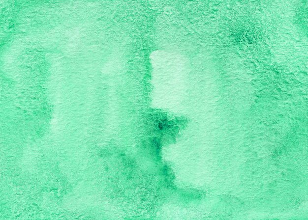 Grüner abstrakter Aquarellhintergrund auf strukturiertem Papier. Handgemachter Aquarellhintergrund
