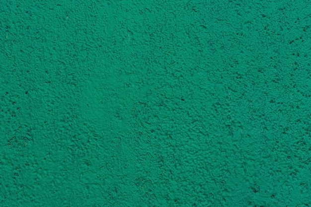 Grüner abstrakter Hintergrund Schöne grüne texturierte Stuck an der Wand Hintergrund aus grünem Stuck