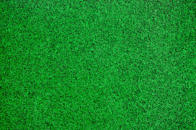 Grüner künstlicher Draufsichthintergrund des Grases.