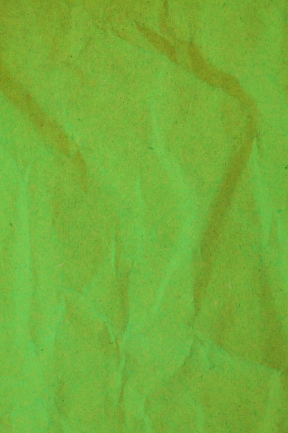 Grüner zerknitterter Papierhintergrund.