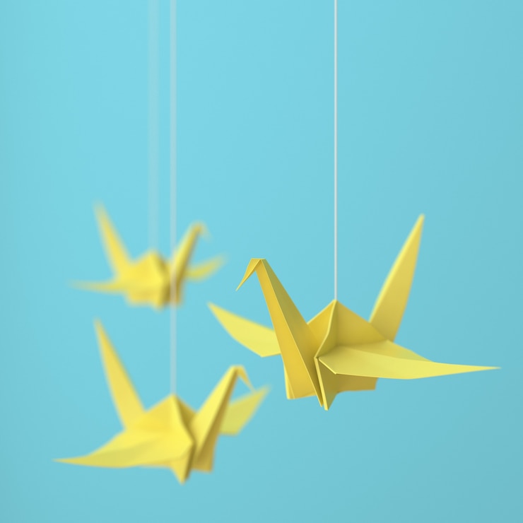 Foto grulla de origami amarilla
