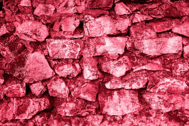 Grunge alte Ziegelwand als Hintergrundtonung in Farbe 2023 Viva Magenta