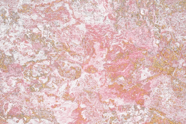 Grunge Goldglitter auf einem rosa strukturierten Hintergrund