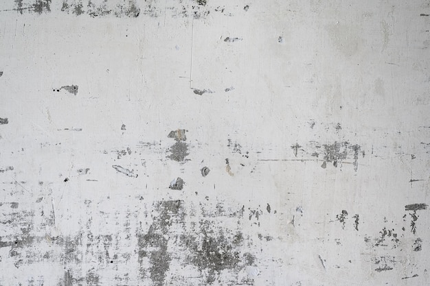 Grunge Hintergrund weiße schäbige Wand mit Rissen und Flecken