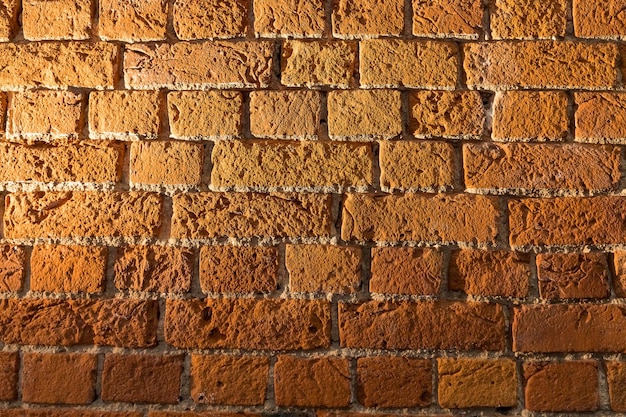 Grunge-TexturBricks Wand mit Lichtfleck auf der linken Seite Hintergründerot braun Brickwall Zement Hintergrund Vintage rotbraun Brickwall