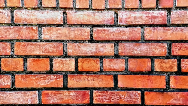 Grungy orange Backsteinmauer-Beschaffenheits-Hintergrund