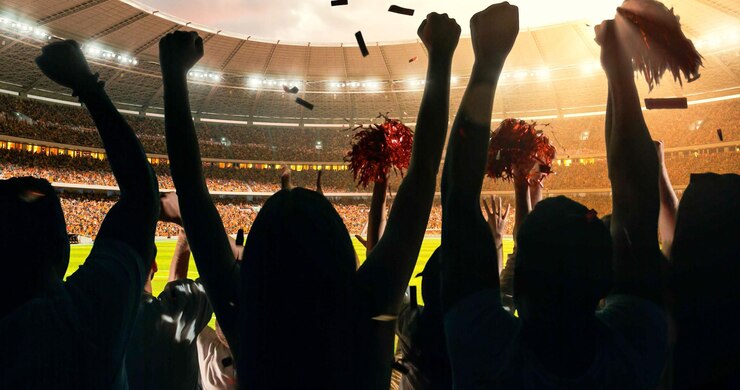 Foto un grupo de aficionados entusiastas ven un campeonato deportivo en el estadio su equipo gana y todo el mundo está celebrando este evento la gente está vestida con ropa casual
