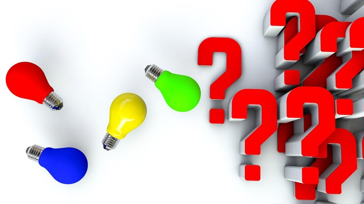 Foto un grupo de bombillas con signos de interrogación en la parte inferior.