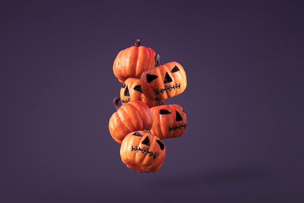 Grupo de calabazas que caen para Halloween en fondo púrpura con espacio de copia Concepto creativo de Halloween