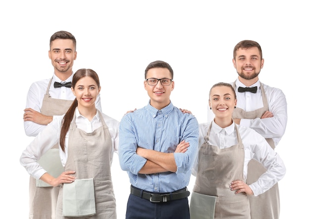 Grupo de camareros con profesor en blanco