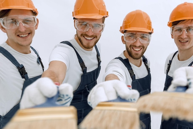 Grupo de construtores com ferramentas diferentes