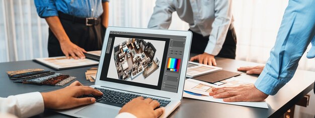 Grupo de equipo de diseño de arquitectos de interiores en la mesa eligiendo varias muestras de paneles de estado de ánimo con software de arquitectura en la pantalla del portátil Renovación moderna y concepto de selección de materiales interiores Insight