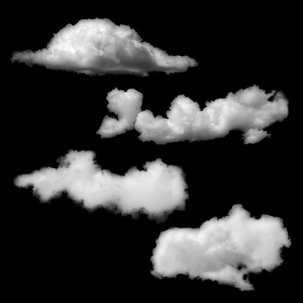 Grupo de nubes esponjosas blancas sobre un fondo negro aislado