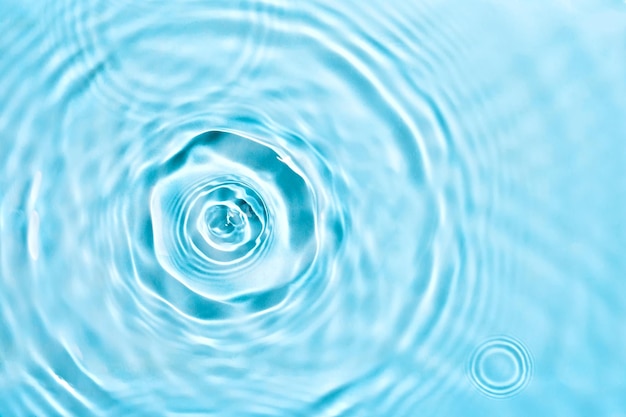 Água micelar hidratante cosmética Fundo líquido transparente abstrato com círculos concêntricos Foco suave