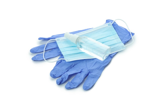 Guantes médicos con máscara y antiseptik, aislado en blanco