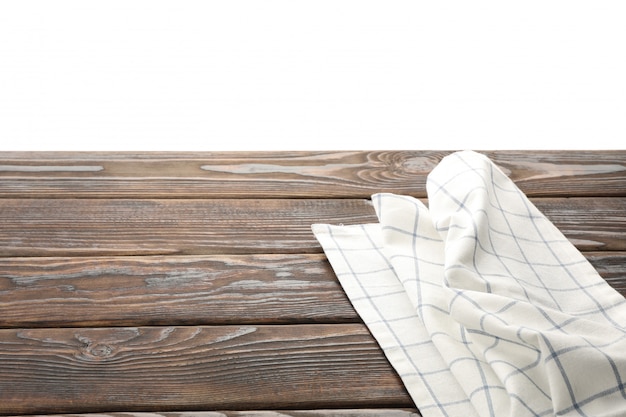 Foto guardanapo de tecido na mesa contra o fundo branco, espaço para texto