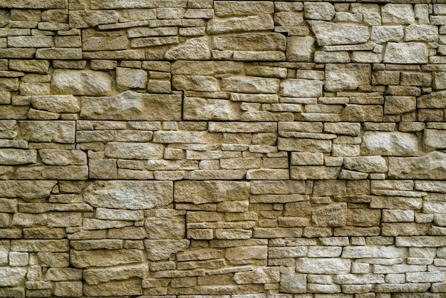 Guijarros de piedra vieja pared vintage textura fondo ladrillo revestimiento piedras de diferentes tamaños