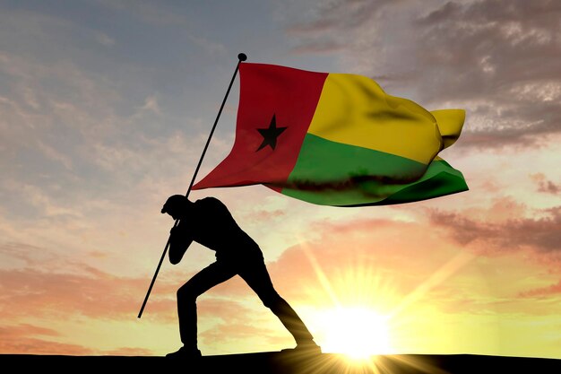 Guinea-Bissau-Flagge wird von einer männlichen Silhouette 3D-Rendering in den Boden gedrückt