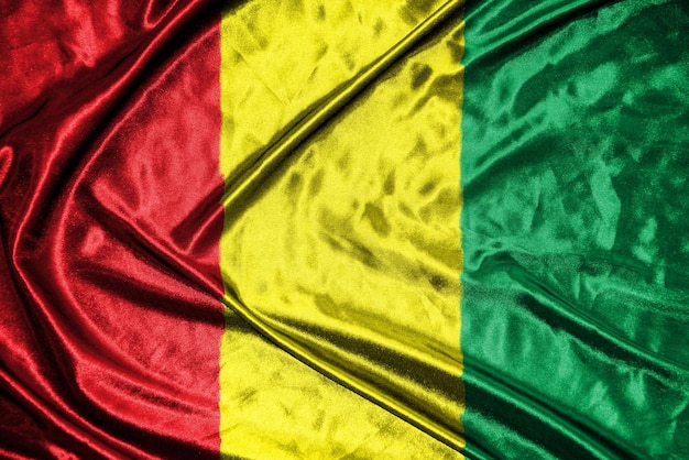 Guinea-Stoffflagge. Satin-Flagge, wehende Stoffstruktur der Flagge