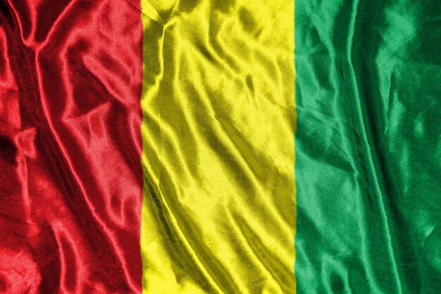 Guinea-Stoffflagge. Satin-Flagge, wehende Stoffstruktur der Flagge