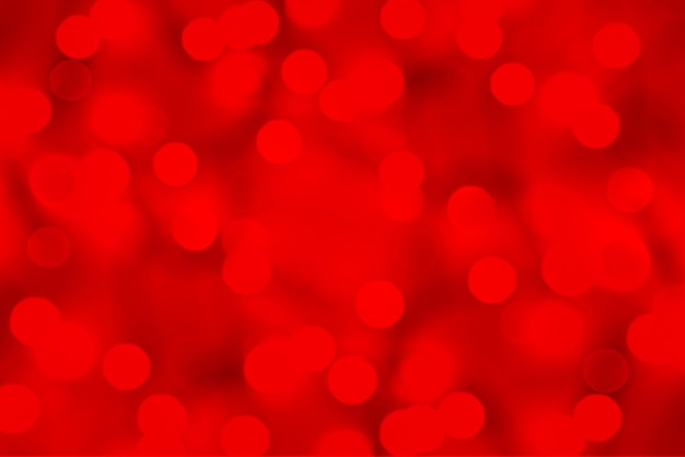 Guirlanda de bokeh brilhante na cor vermelha brilhante Natal e fundo de ano novo com foco suave