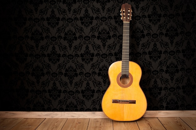 Foto guitarra clásica en un fondo vintage