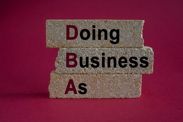 Hacer negocios como símbolo Texto Hacer negocio como en bloques de ladrillo hermoso fondo rojo