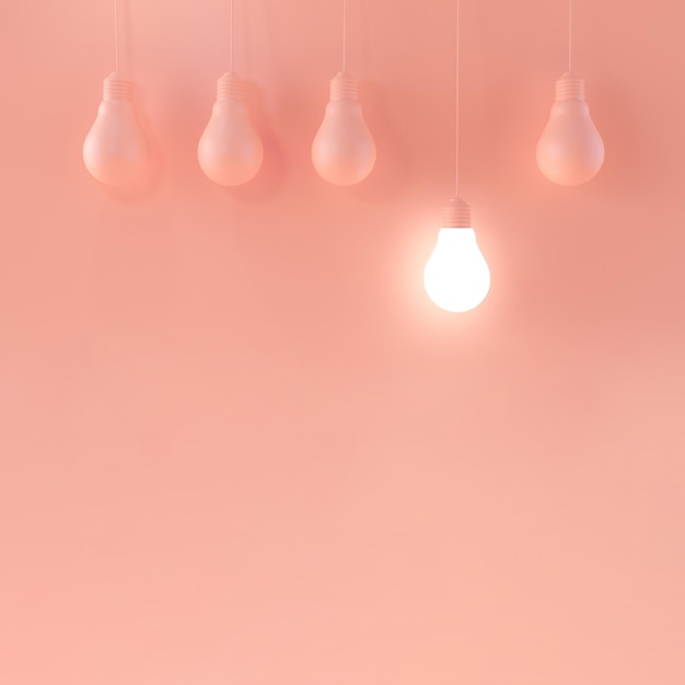 Hängende Glühlampen auf buntem rosa Hintergrund