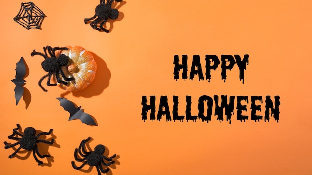 Halloween em branco ou convite para festa divertida com aranhas pretas e teia de aranha em fundo laranja. Estilo plano leigo, vista superior. Acessórios de festa. Feliz Dia das Bruxas - texto.