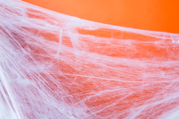 Halloween gruseliges Spinnennetz mit orangefarbenem Hintergrund