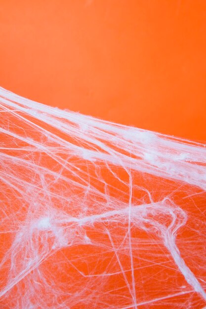 Halloween gruseliges Spinnennetz mit orangefarbenem Hintergrund