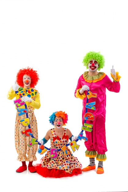 Halten mit drei lustiges spielerisches Clowns