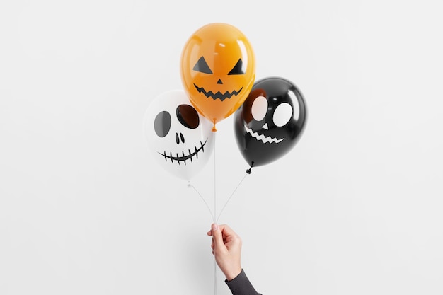 Foto hand der frau, die halloween-geistballon auf weißem hintergrund hält