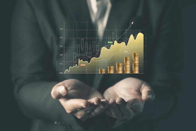 Hand, die Aktiendiagramm-Finanz- und Bankkonzept hält