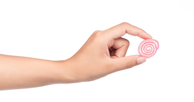 Hand, die bunte Süßigkeiten, Geleebonbons lokalisiert auf weißem Hintergrund hält