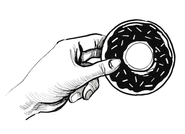 Foto hand, die einen donut hält. tinte schwarz-weiß-zeichnung