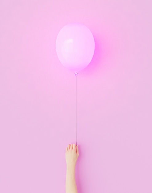 Hand hält einen rosa Luftballon