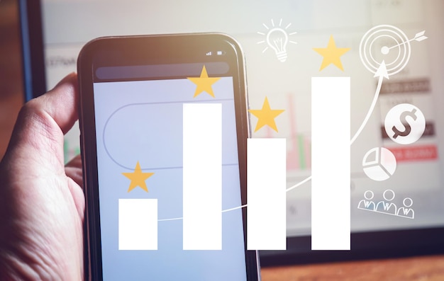 Foto handheld-telefon mit wirtschaftswachstum diagramm diagramm des guten handels des geschäfts wachstum ikonenkonzept