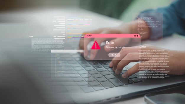 Hands typing on laptop with coding error alert popup representing software bugs programming issues or system failure in development process and debugging in tech environments