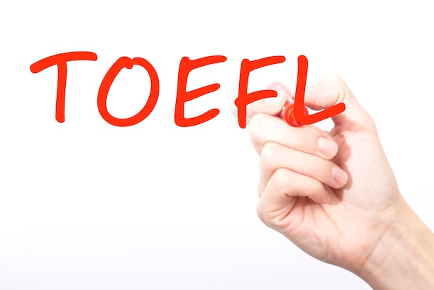 Handschriftaufschrift TOEFL mit rotem Farbmarkierungskonzept stockbild