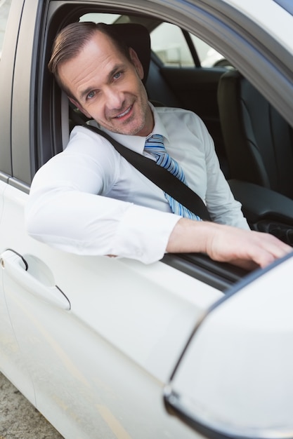 Handsome businessman smiling at camera