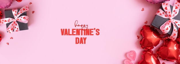 Happy Valentines Day Text auf Grußkarte Banner mit Geschenkbox mit Ballons in Bogen- und Herzform auf rosa Hintergrund