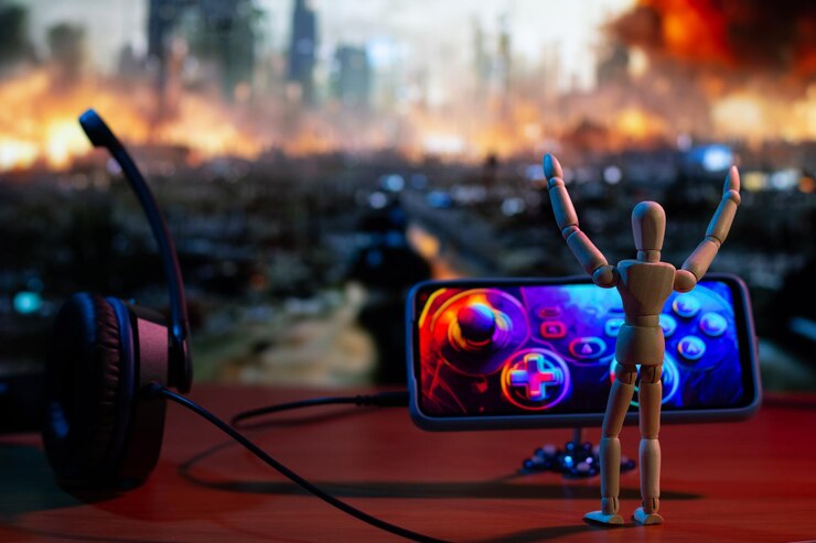 Happy Wooden Doll feiert den Sieg im Kriegsspiel mit dem Handy als Wireless Controller